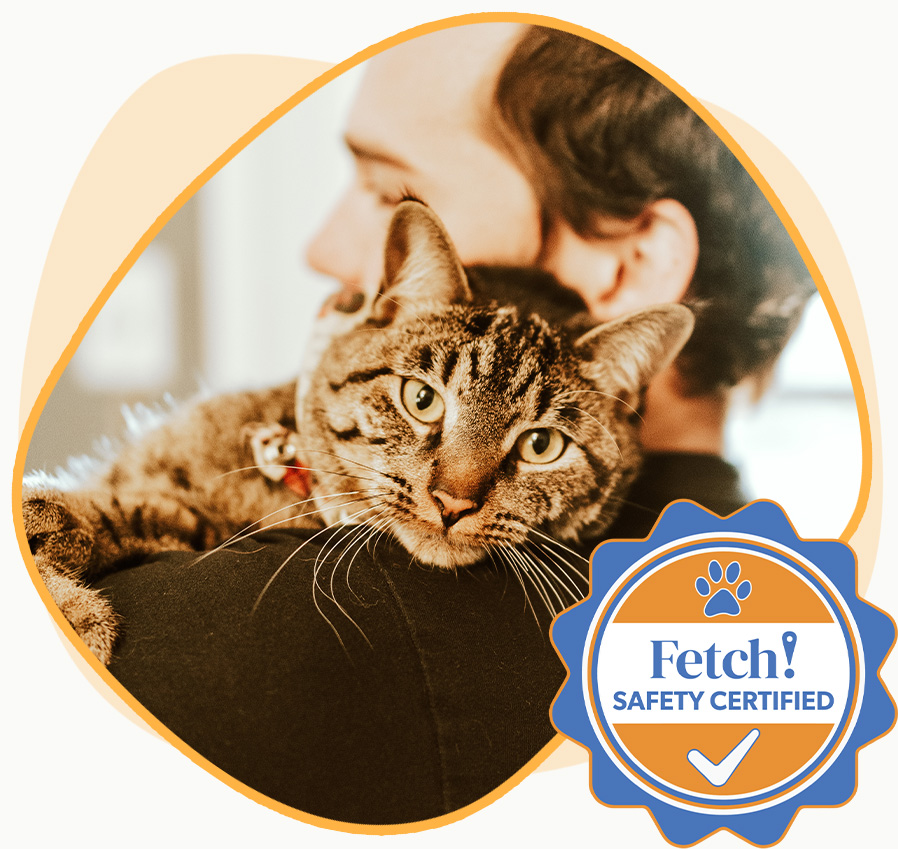 And image of a person holding a cat overlapped by a Fetch safety certfied badge