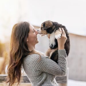 Person holding a puppy